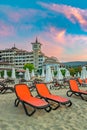 Sunny Beach, Bulgaria - 4 Sep 2018: Umbrellas and chair lounges at sunrise in Sunny Beach, a major seaside resort on the Black Sea