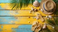 Sunny Beach Day: Yellow Wooden Plank with Beach Accessories - Hat, Towel, Flip Flops, Seashells, and Palm Leaves Royalty Free Stock Photo