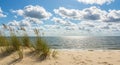 Sunny Beach Scene with Blue Sky and White Clouds Royalty Free Stock Photo