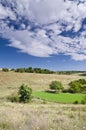 Sunny Blue Sky, Meadow and hills Royalty Free Stock Photo