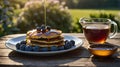 Delicious Blueberry Pancakes with Maple Syrup Pouring on Top in Natural Setting Royalty Free Stock Photo