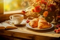 Sunny breakfast table with coffee, croisants and an open book against the light at a window, made with generative ai