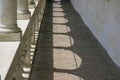 Sunny building corridor colonnade shadow pattern Royalty Free Stock Photo