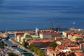 Sunny cityscape of Rijeka, Croatia, with rooftops and blue sea