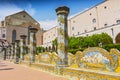 Sunny cloister of the Clarisses decorated with majolica tiles from Santa Chiara Monastery in Naples, Italy