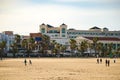 Sunny and cloudy day on La Malvarrosa beach promenade in Valencia, Spain