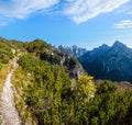 Sunny colorful autumn alpine scene. Peaceful rocky mountain view from hiking path near Almsee lake, Upper Austria Royalty Free Stock Photo