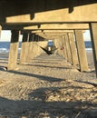 A sunny concrete pier and the Atlantic Ocean - Tybee Island - GEORGIA - USA Royalty Free Stock Photo