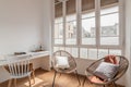 Sunlit living room with cozy furniture and pillows near window Royalty Free Stock Photo