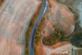 Sunny day, agricultural fields of Italy with a road photographed with drone from above. Royalty Free Stock Photo