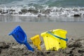 Colorful children toys for sand on the beach by the sea. Royalty Free Stock Photo