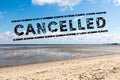 Sunny day beach and text cancelled - vacation cancel