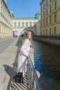 Sunny day, beautiful girl on the waterfront Royalty Free Stock Photo