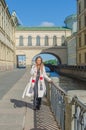 Sunny day, beautiful girl on the waterfront Royalty Free Stock Photo