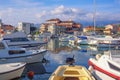 Sunny day, beautiful Mediterranean landscape. Fishing boats in harbor. Montenegro, Tivat city Royalty Free Stock Photo