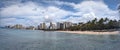 Sunny Day at a Bustling Waikiki Beach Overlooking the Pacific Ocean