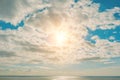 Sunny day with clouds over the sky above the sea Royalty Free Stock Photo