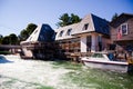 Sunny Day at Empire Michigan Waterfront with Boat and Riverside Buildings