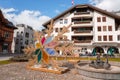 Sunny Day at Engelberg Town Square with Artistic Snowflake Sculpture