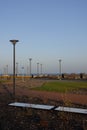 Sunny day with green grass and blue sky. Young trees. Reidi tee promenade. Modern space for walking and rest in a city