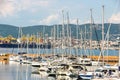 Sunny day in harbor. View of yachts moored in a small coastal town Muggia