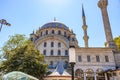 Sunny day at istanbul mosque with domes, minaret, and blue sky Royalty Free Stock Photo