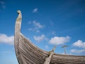 On a sunny day with light cloud, the prow of the Skidbladner - a full size replica of a Viking ship on show in Shetland, UK Royalty Free Stock Photo