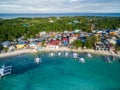 Sunny Day in Malapascua Island in Visayan Sea, One of Cebu Island. Sea water and Boats. Bounty Beach with Local Architecture Royalty Free Stock Photo