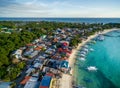 Sunny Day in Malapascua Island in Visayan Sea, One of Cebu Island. Sea water and Boats. Bounty Beach with Local Architecture Royalty Free Stock Photo