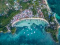 Sunny Day in Malapascua Island in Visayan Sea, One of Cebu Island. Sea water and Boats. Bounty Beach with Local Architecture Royalty Free Stock Photo
