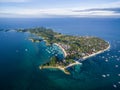 Sunny Day in Malapascua Island in Visayan Sea, One of Cebu Island. Sea water and Boats. Bounty Beach with Local Architecture Royalty Free Stock Photo