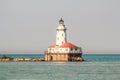 Lighthouse in the middle of the lake in a sunny day Royalty Free Stock Photo