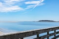 Sunny day on an old wooden fishing pier looking out over water and land, Tybee Island Georgia USA Royalty Free Stock Photo