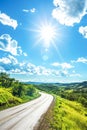 Sunny Day Over a Curved Country Road in a Lush Green Landscape Royalty Free Stock Photo