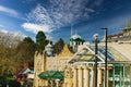 Sunny day over historic buildings with blue sky and fluffy clouds in Harrogate, England