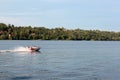 Sunny day on the river. Lovers ride in a boat on a lake during a beautiful sunset. Happy couple woman and man together relaxing on Royalty Free Stock Photo