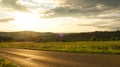 A sunny day in the Saarland with a view over meadows into the valley. Road in the foreground Royalty Free Stock Photo