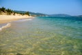 Sunny day, sand creaking, clear turquoise sea, coral reefs on the coast of Yalong Bay in South China Sea. Sanya, island Hainan, Royalty Free Stock Photo