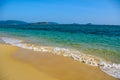 Sunny day, sand creaking, clear turquoise sea, coral reefs on the coast of Yalong Bay in South China Sea. Sanya, island Hainan, Royalty Free Stock Photo