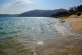 Sunny day, sand creaking, clear turquoise sea, coral reefs on the coast of Yalong Bay in South China Sea. Sanya, island Hainan, Royalty Free Stock Photo