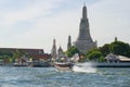 Sunny day at the Wat Arun temple. Chao Phraya River, Bangkok