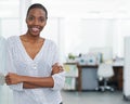 Sunny days make work a pleasure. Portrait of a young business woman standing with her arms crossed. Royalty Free Stock Photo