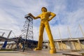 Sunny exterior view of the Golden Driller Statue in Tulsa Expo Center