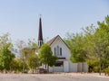 Sunny exterior view of the historical Candlelight Wedding Chapel