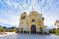 Sunny exterior view of the San Carlos Cathedral with beautiful clouds