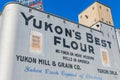 Sunny exterior view of the Yukon Mill and Grain Co