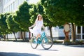 Sunny girl riding in sun on blue retro bicycle Royalty Free Stock Photo