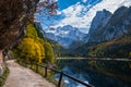 Peaceful autumn Alps mountain lake with clear transparent water and reflections. Gosauseen or Vorderer Gosausee lake, Upper Royalty Free Stock Photo