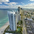 Sunny Isles Beach city with luxurious highrise hotels and condo buildings and busy ocean drive on Atlantic coast Royalty Free Stock Photo
