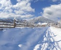 Sunny landscape in the mountain village. Winter morning. Royalty Free Stock Photo